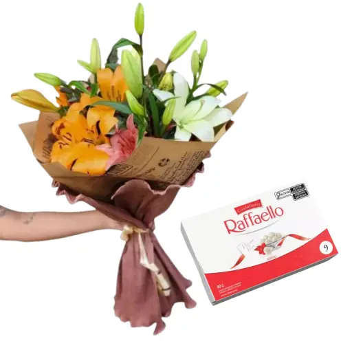 Ramo de flores lilium lirios terra con bombones raffaello